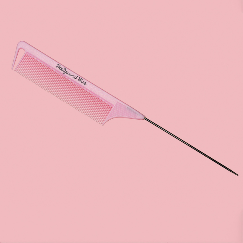 Comb for combing and styling hair with a spike